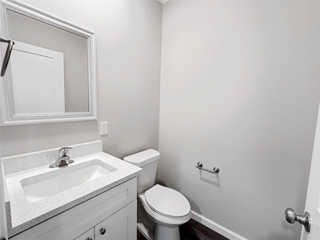 bathroom with toilet and vanity