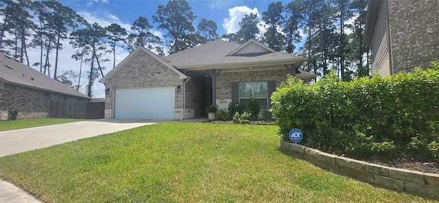 view of front of home featuring a front yard and a garage