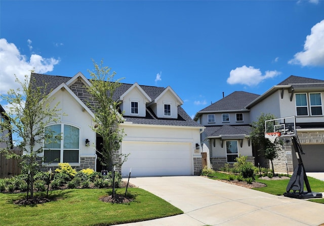 view of front of property featuring driveway, a garage, fence, a front lawn, and stone siding