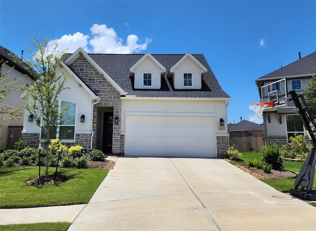 view of front facade featuring fence, stucco siding, concrete driveway, and stone siding