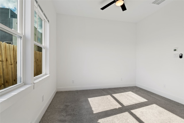 spare room featuring carpet flooring and ceiling fan