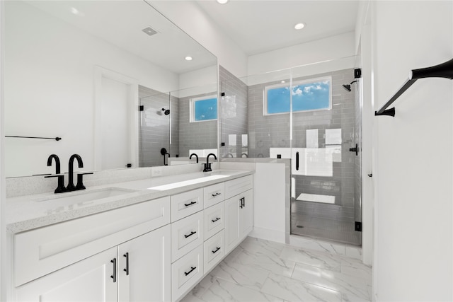 bathroom featuring vanity and an enclosed shower