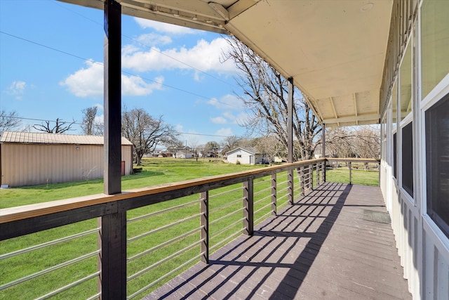 wooden deck with a lawn