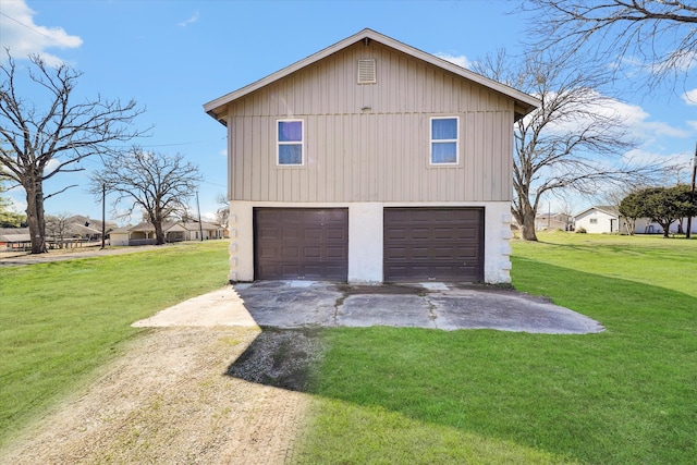 garage featuring a yard