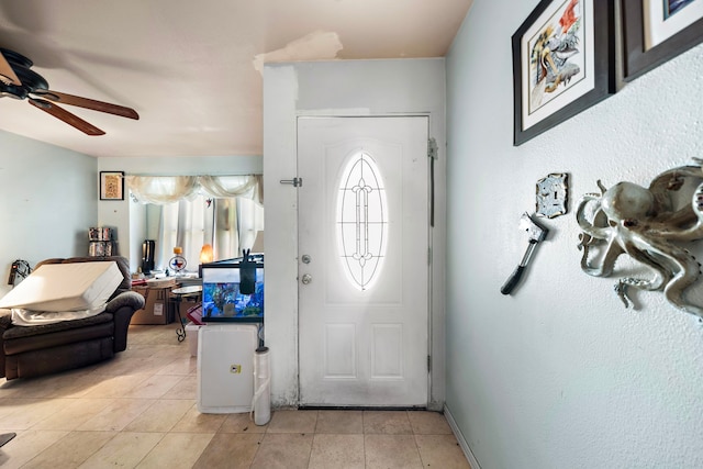 entryway with ceiling fan and light tile patterned floors