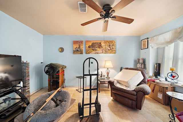 sitting room featuring ceiling fan and light tile patterned floors