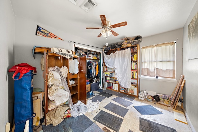 interior space featuring ceiling fan