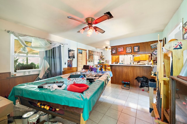 interior space featuring ceiling fan and light tile patterned flooring