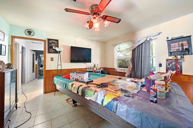 interior space featuring light tile patterned floors and ceiling fan