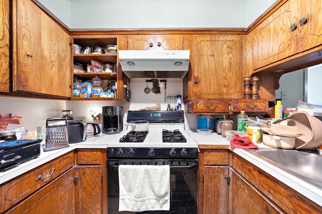 kitchen with white gas stove