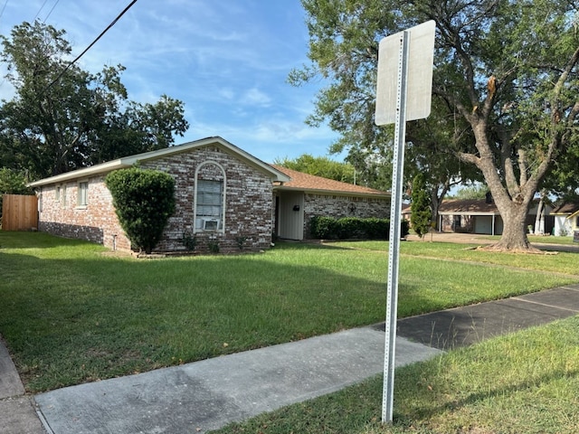 ranch-style house with a front lawn