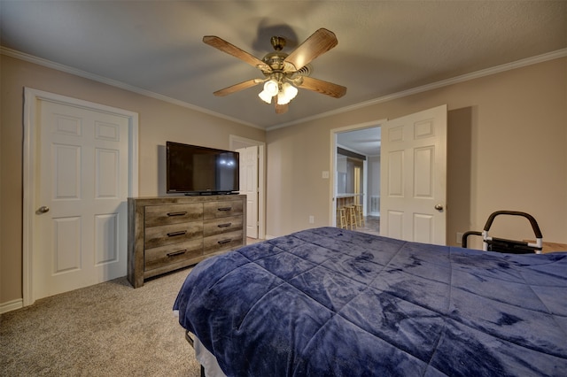 bedroom with carpet, a textured ceiling, ceiling fan, and ornamental molding