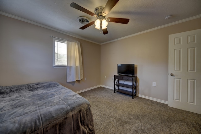 bedroom featuring carpet, a textured ceiling, ceiling fan, and crown molding