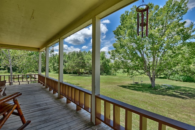 deck featuring a lawn