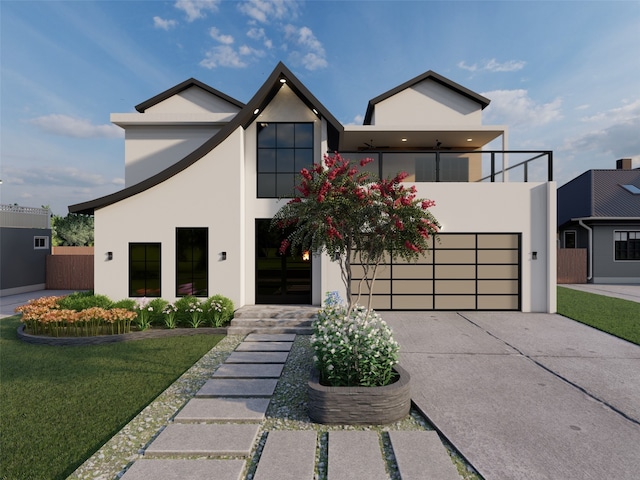 contemporary house featuring a garage and a front lawn