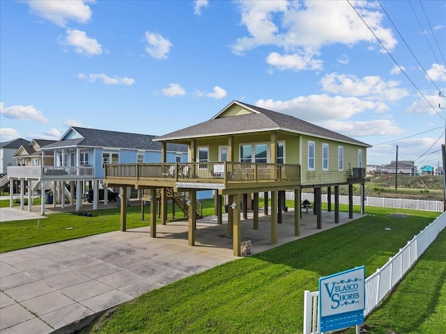 119 Velasco Shores Dr, Surfside Beach, TX 77541 - view of community featuring a carport, concrete driveway, and stairs