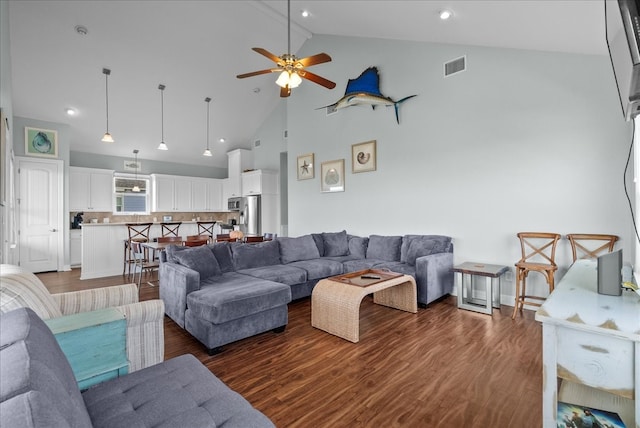 living room featuring high vaulted ceiling, dark hardwood / wood-style floors, and ceiling fan