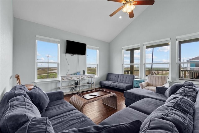 119 Velasco Shores Dr, Surfside Beach, TX 77541 - living area with high vaulted ceiling, a ceiling fan, and wood finished floors