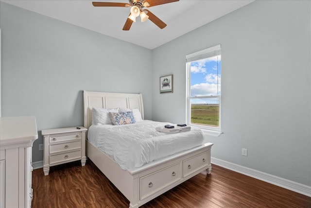 bedroom with ceiling fan and dark hardwood / wood-style flooring