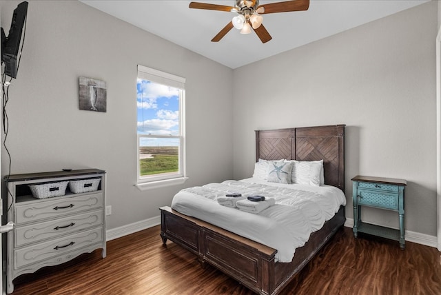 bedroom featuring ceiling fan and dark hardwood / wood-style floors