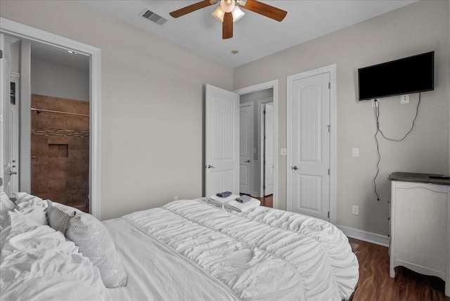 119 Velasco Shores Dr, Surfside Beach, TX 77541 - bedroom with dark wood-style flooring and a ceiling fan
