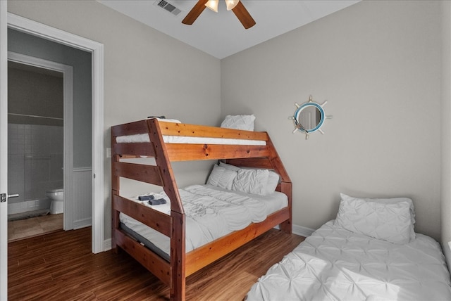 bedroom with ensuite bath, hardwood / wood-style flooring, and ceiling fan