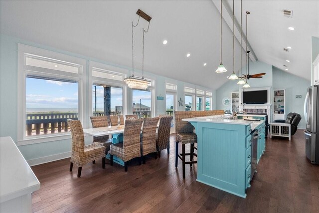 kitchen featuring blue cabinets, dark hardwood / wood-style floors, and decorative light fixtures