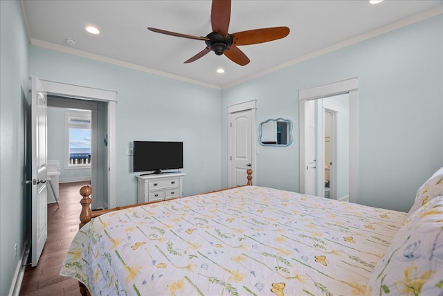 bedroom featuring ornamental molding, dark wood-type flooring, and ceiling fan