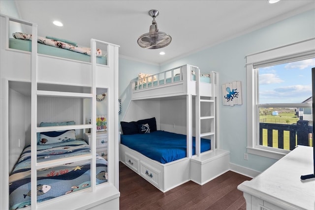 bedroom featuring ornamental molding and dark hardwood / wood-style floors