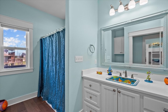 bathroom with vanity and hardwood / wood-style floors