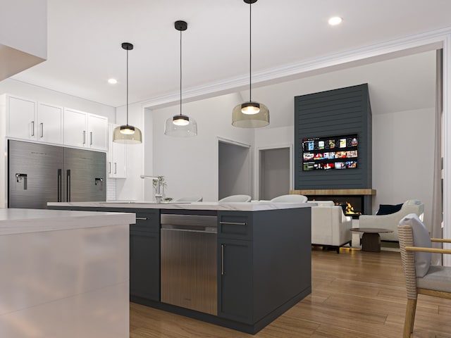 kitchen with sink, dark wood-type flooring, built in refrigerator, pendant lighting, and white cabinets