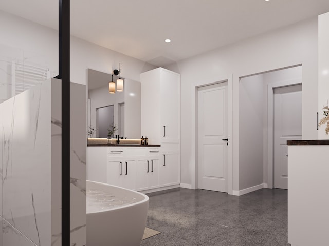 bathroom with a bathing tub and vanity