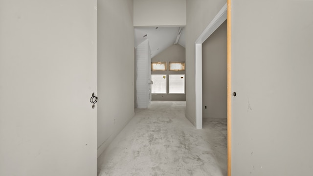 corridor with lofted ceiling