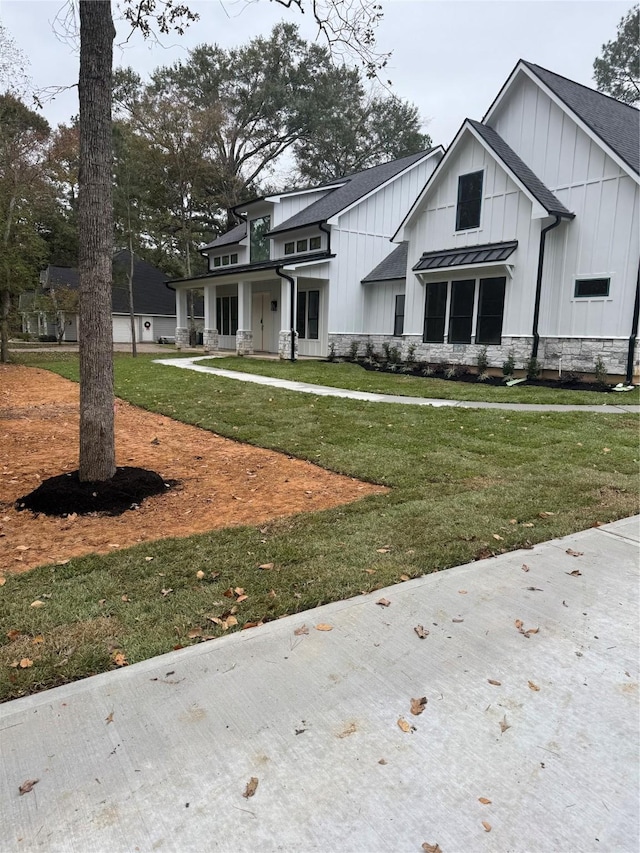 modern farmhouse with a front yard