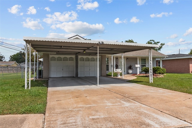 view of front of home featuring a carport, a garage, and a front lawn