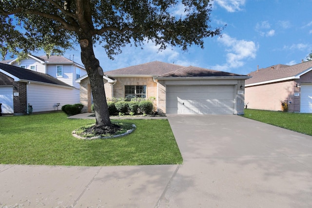 view of front facade with a garage and a front lawn