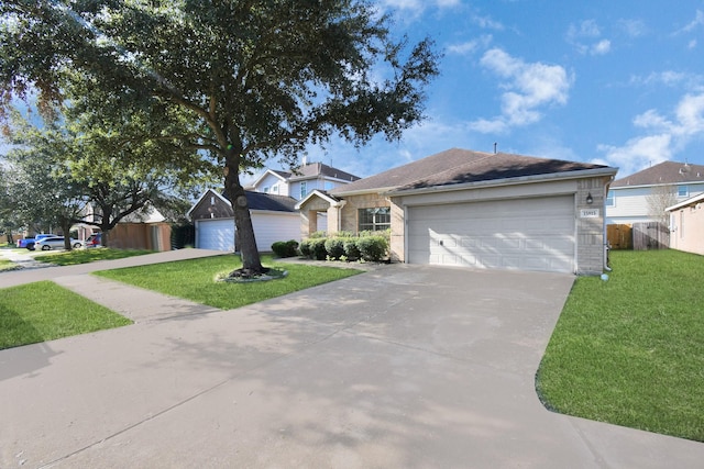 single story home featuring a garage and a front lawn