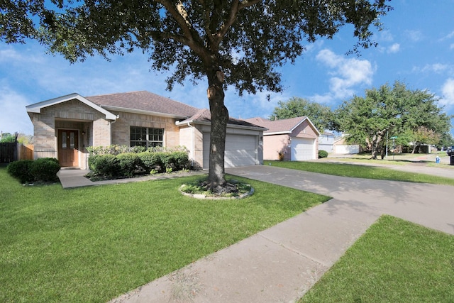 single story home with a front lawn and a garage