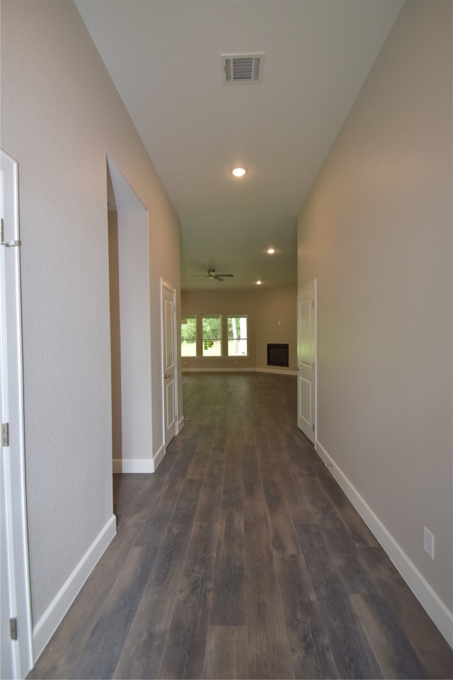 corridor with dark wood-type flooring