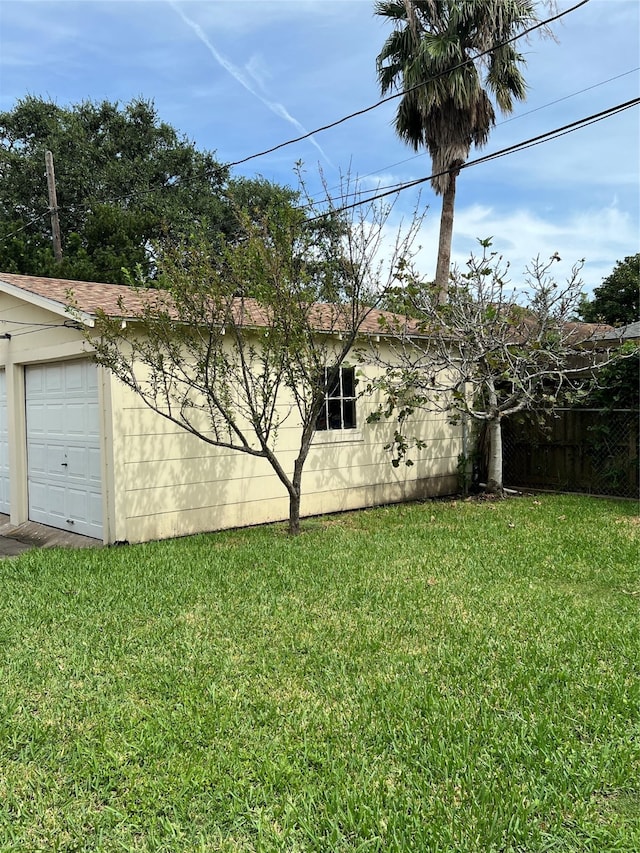 view of yard with a garage