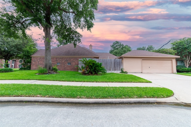 ranch-style home with fence, a front lawn, and brick siding