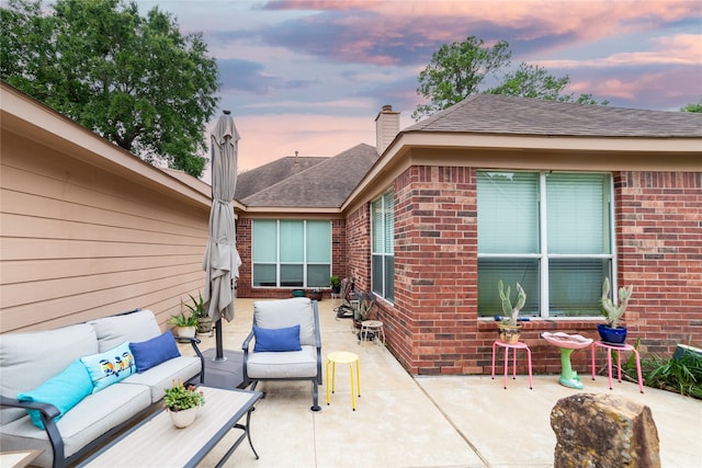 patio terrace at dusk with an outdoor living space