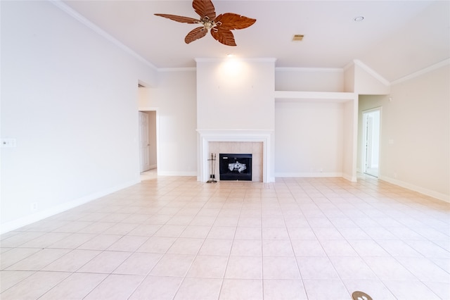 unfurnished living room with ornamental molding, a tile fireplace, visible vents, and ceiling fan