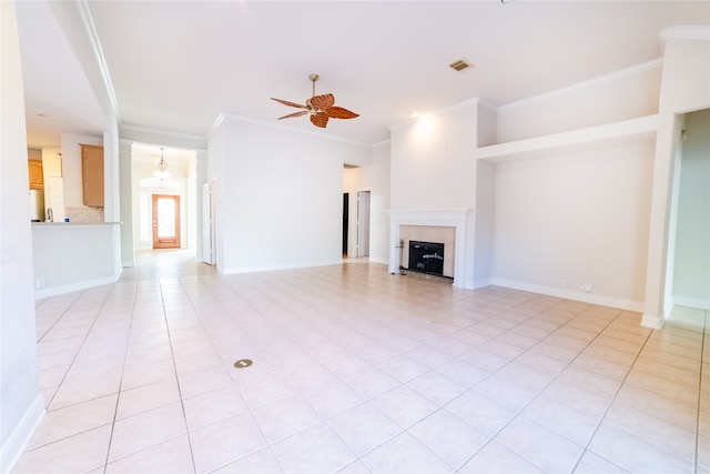 unfurnished living room featuring ceiling fan, a fireplace, visible vents, and baseboards