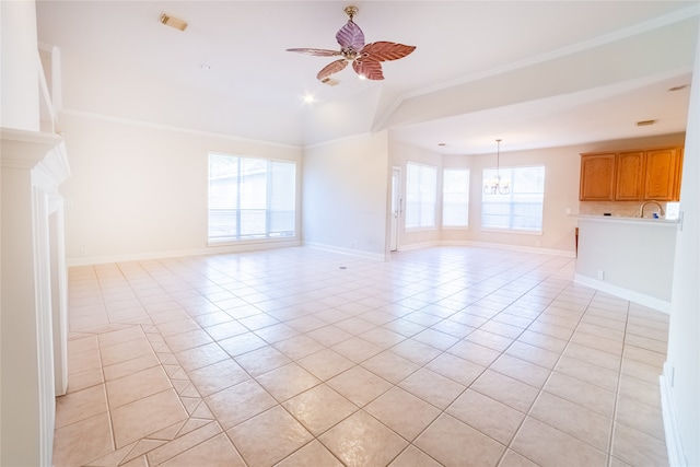 empty room featuring baseboards, ceiling fan with notable chandelier, crown molding, and light tile patterned flooring