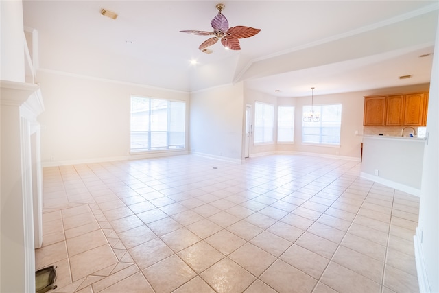 unfurnished living room with light tile patterned floors, baseboards, crown molding, and ceiling fan with notable chandelier