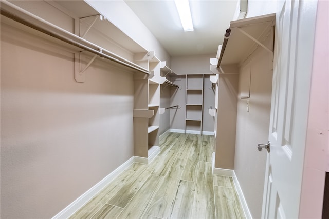 walk in closet featuring light wood-type flooring