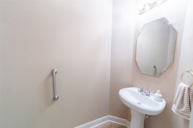 bathroom featuring tile patterned flooring and baseboards