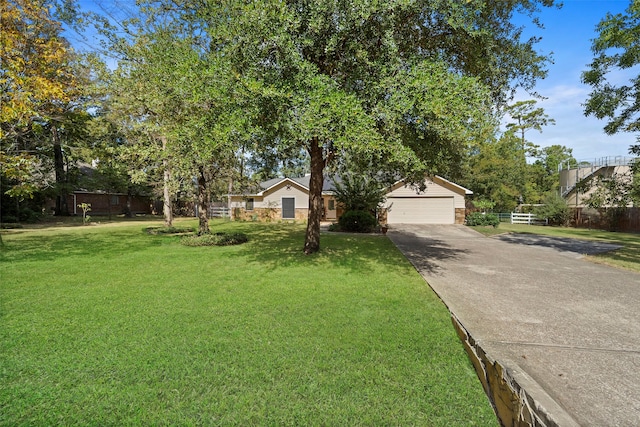 view of front of property with an outdoor structure, a front lawn, and a garage