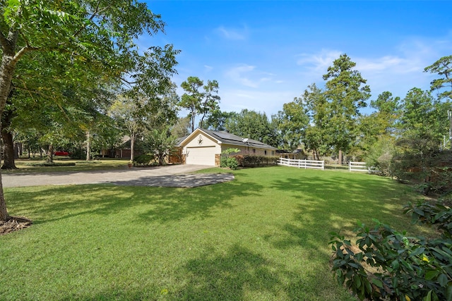 view of yard with a garage